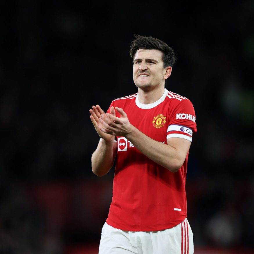 MANCHESTER, ENGLAND - MARCH 12: Harry Maguire of Manchester United celebrates towards the fans at the final whistle during the Premier League match between Manchester United and Tottenham Hotspur at Old Trafford on March 12, 2022 in Manchester, England. (Photo by Naomi Baker/Getty Images)